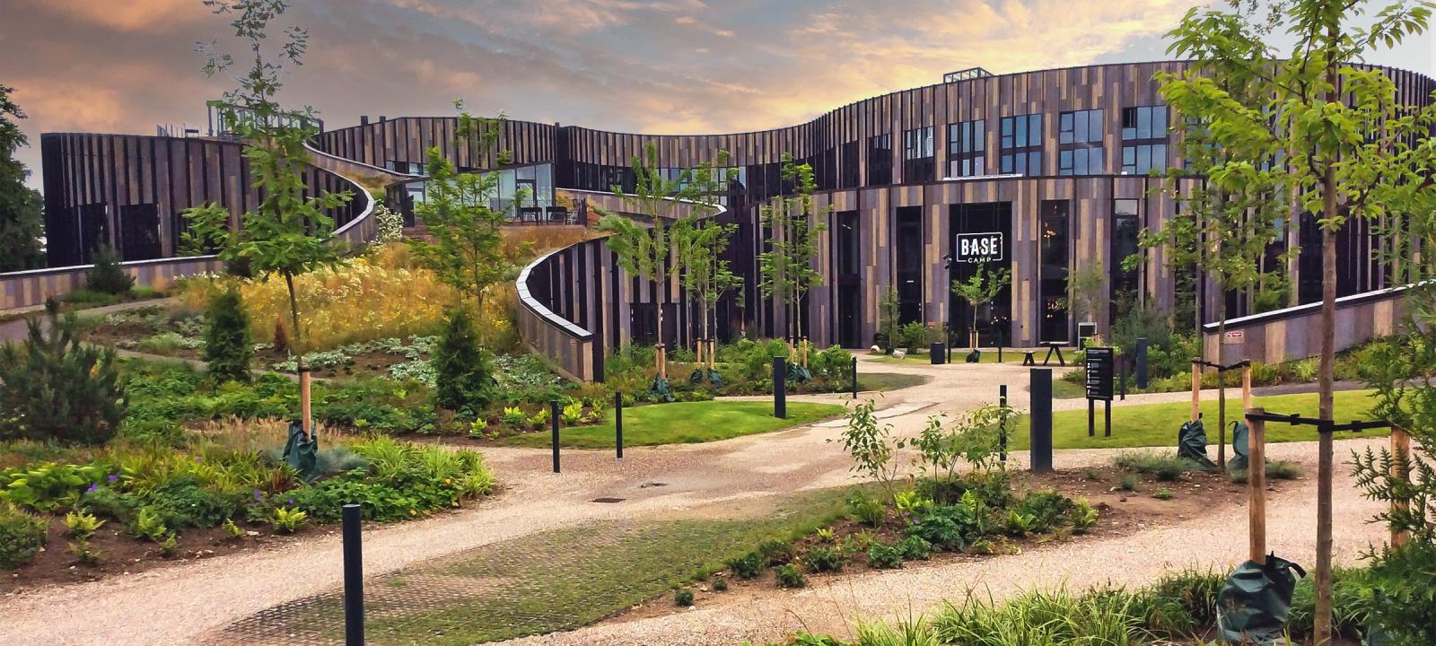 Large building with a pitched green roof